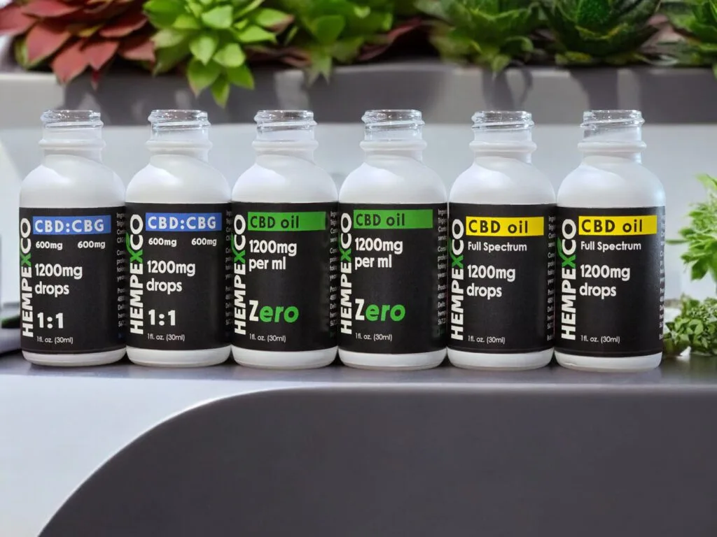 Hempexco CBD Oil Tincture bottles on a counter