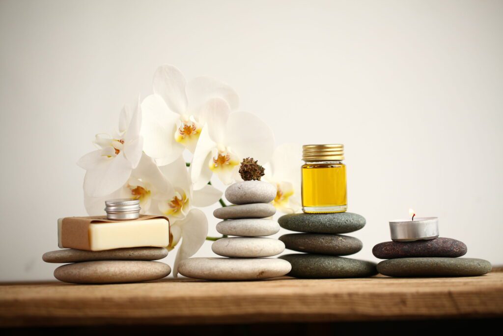 Spa scene with massage stones and oils for create home spa experience